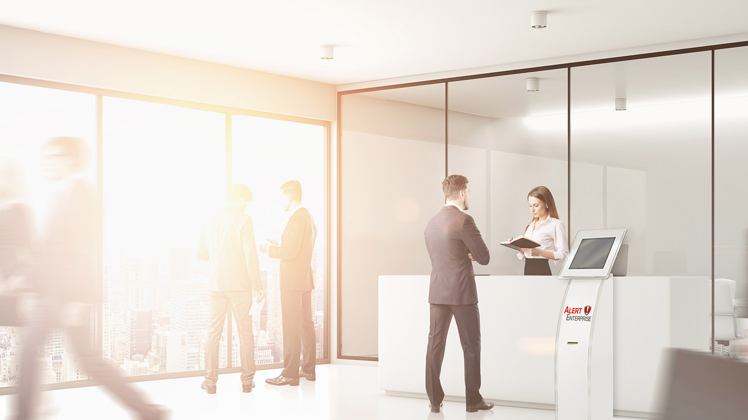 A man is checking into a building as the woman behind the desk it utilizing the visitor identity management software.