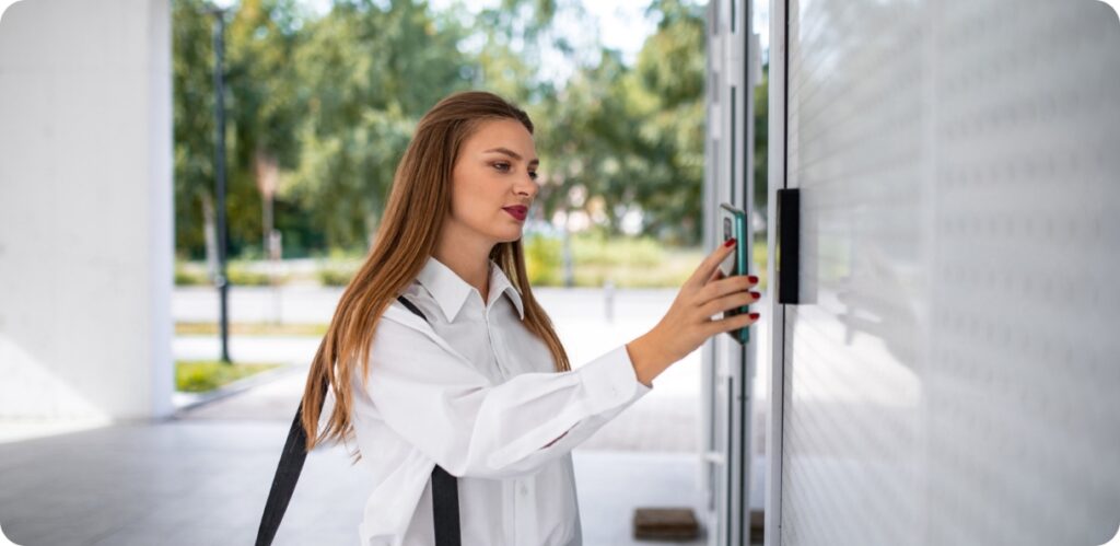 woman scanning mobile entry badge