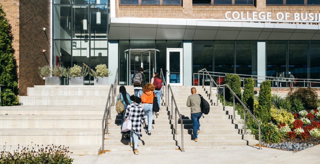 students entering collegiate building