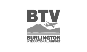 Logo for Burlington International Airport (BTV) featuring a plane silhouette over mountains.