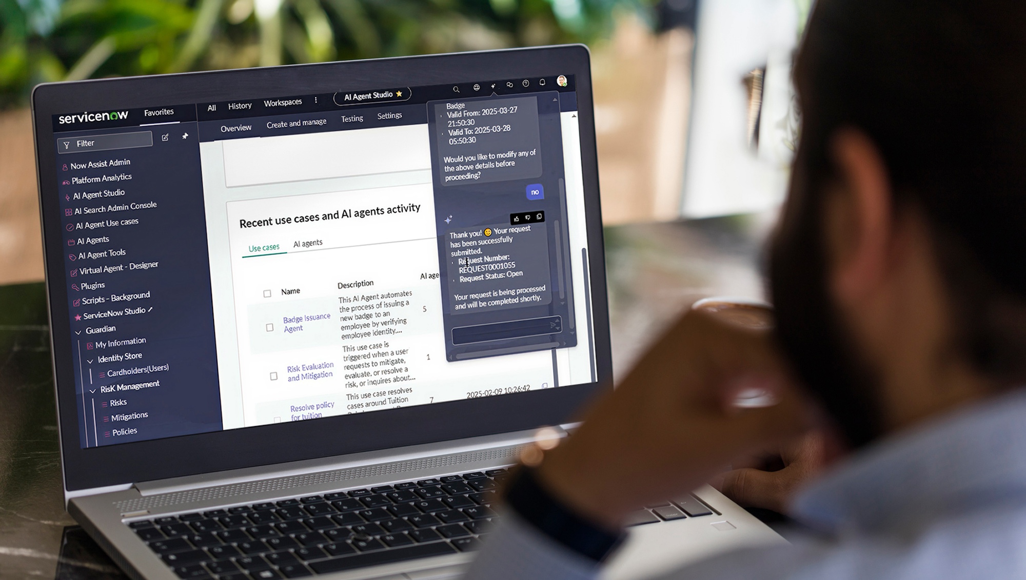 A person looks at a laptop screen displaying a ServiceNow dashboard with recent AI agent activity and a chat window open.