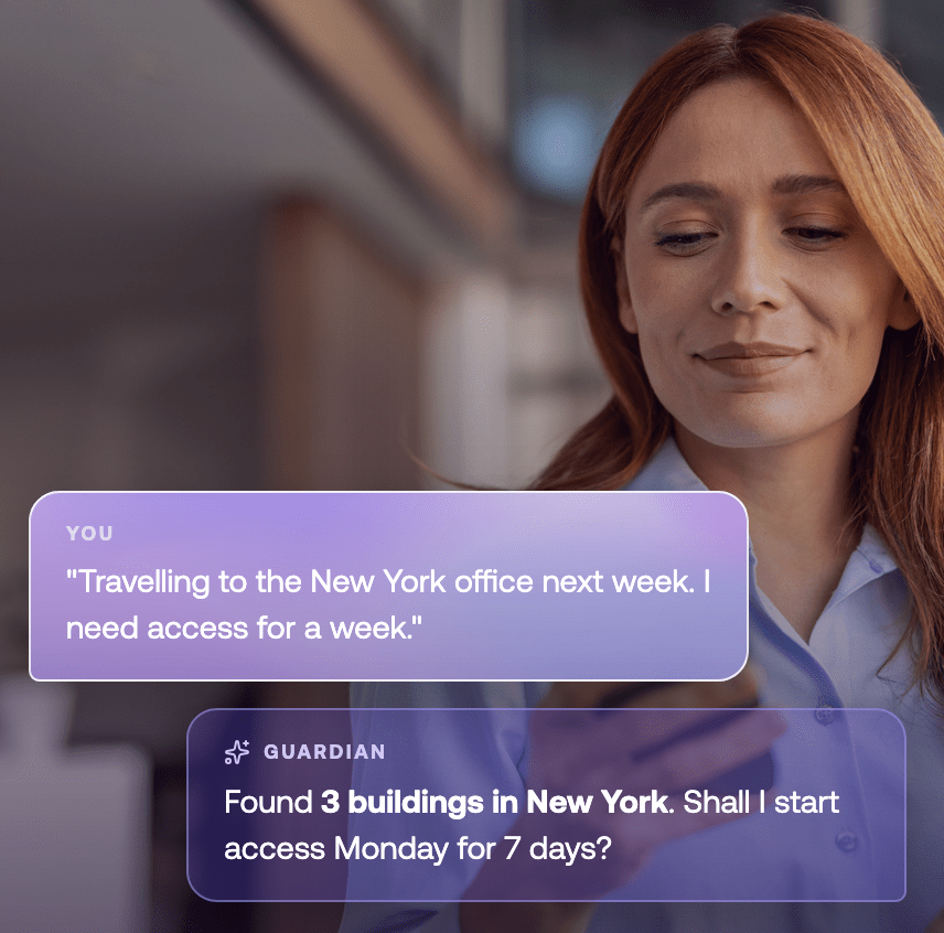 A woman looks at her phone. On-screen messages discuss arranging access to New York office buildings for a week starting Monday.